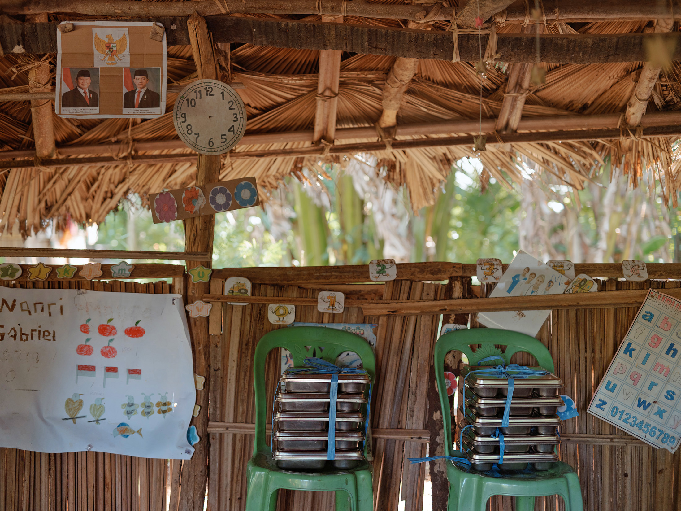 Stacks of free meals at a pre-school in Toineke, East Nusa Tenggara, Indonesia on Tuesday, March 3, 2026. The initiative aims to combat high stunting rates and boost the local economy through locally sourced ingredients. Photographer: Muhammad Fadli/Bloomberg