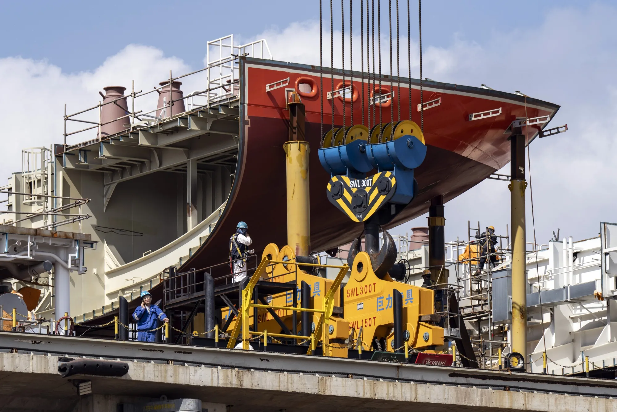Workers at the Cosco Shipping Holding Co. shipyard in Qidong, Jiangsu province, China.