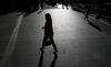 A woman walks near the Roppongi Hills complex in Tokyo.