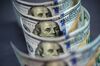 U.S. one-hundred dollar banknotes are arranged for a photograph in Hong Kong, China, on Monday, April 15, 2019. China's holdings of Treasury securities rose for a third month as the Asian nation took on more U.S. government debt amid the trade war between the world’s two biggest economies.