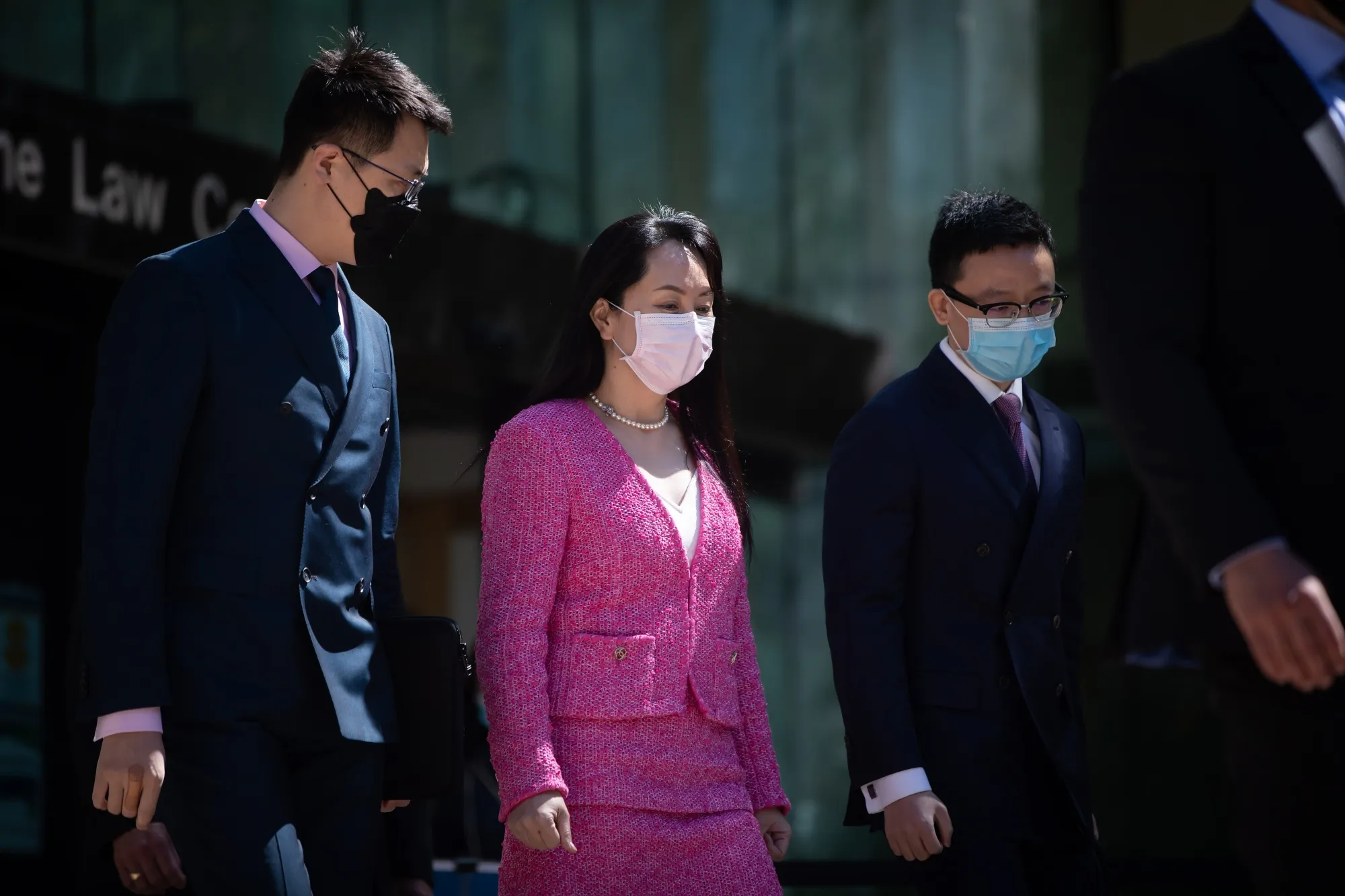 Meng Wanzhou, center, chief financial officer of Huawei Technologies Co., leaves Supreme Court in Vancouver, British Columbia, Canada, on Monday, April 19, 2021.