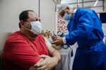 A healthcare worker administers a Covid-19 vaccine in Asuncion, Paraguay, on March 26.