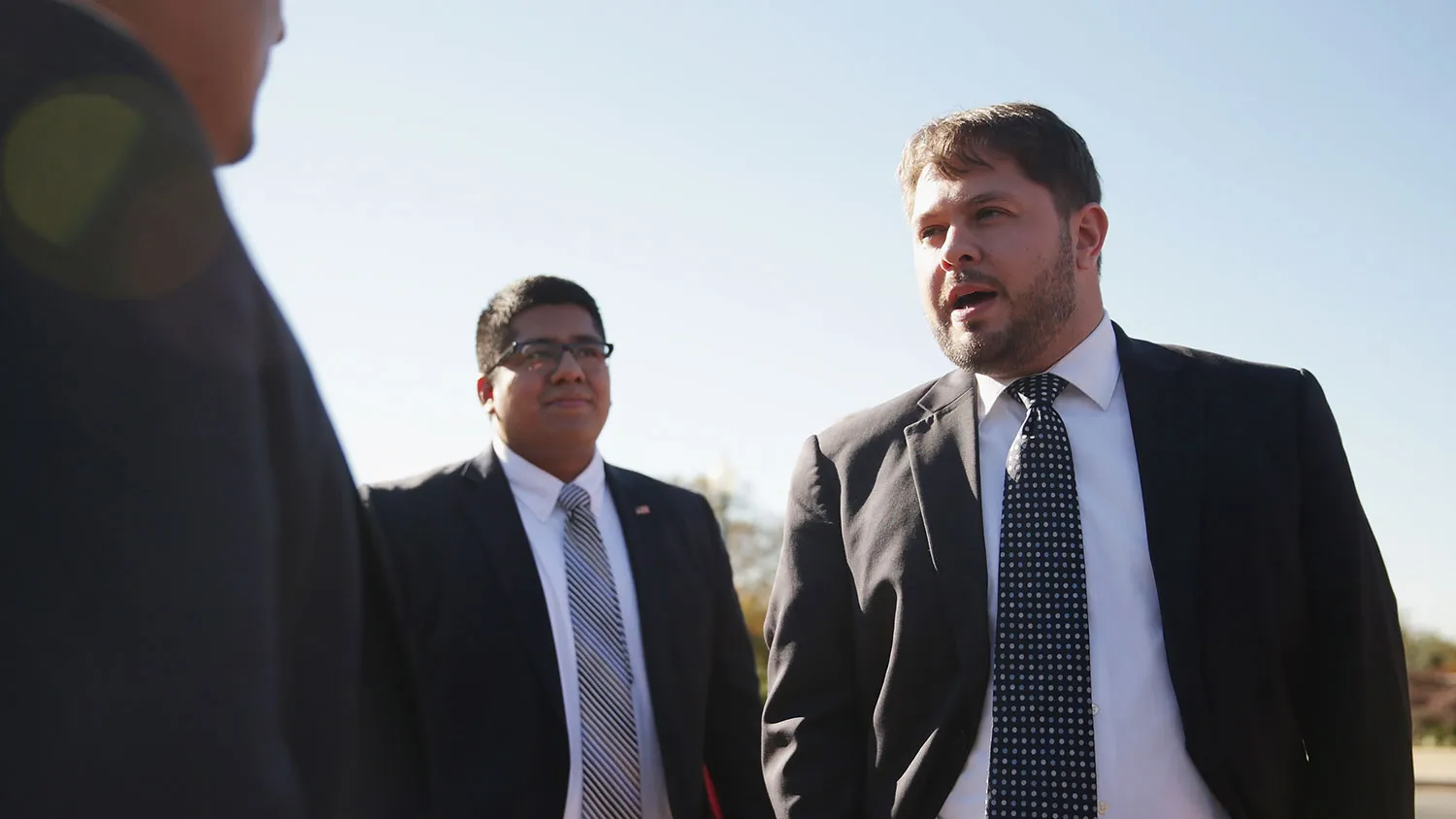 Representative-elect Ruben Gallego (D-AZ) (R) talks with fellow military veterans before a news conference to call on Congress and President Barack Obama to move forward with immigration reform at the U.S. Capitol November 12, 2014 in Washington, DC.
