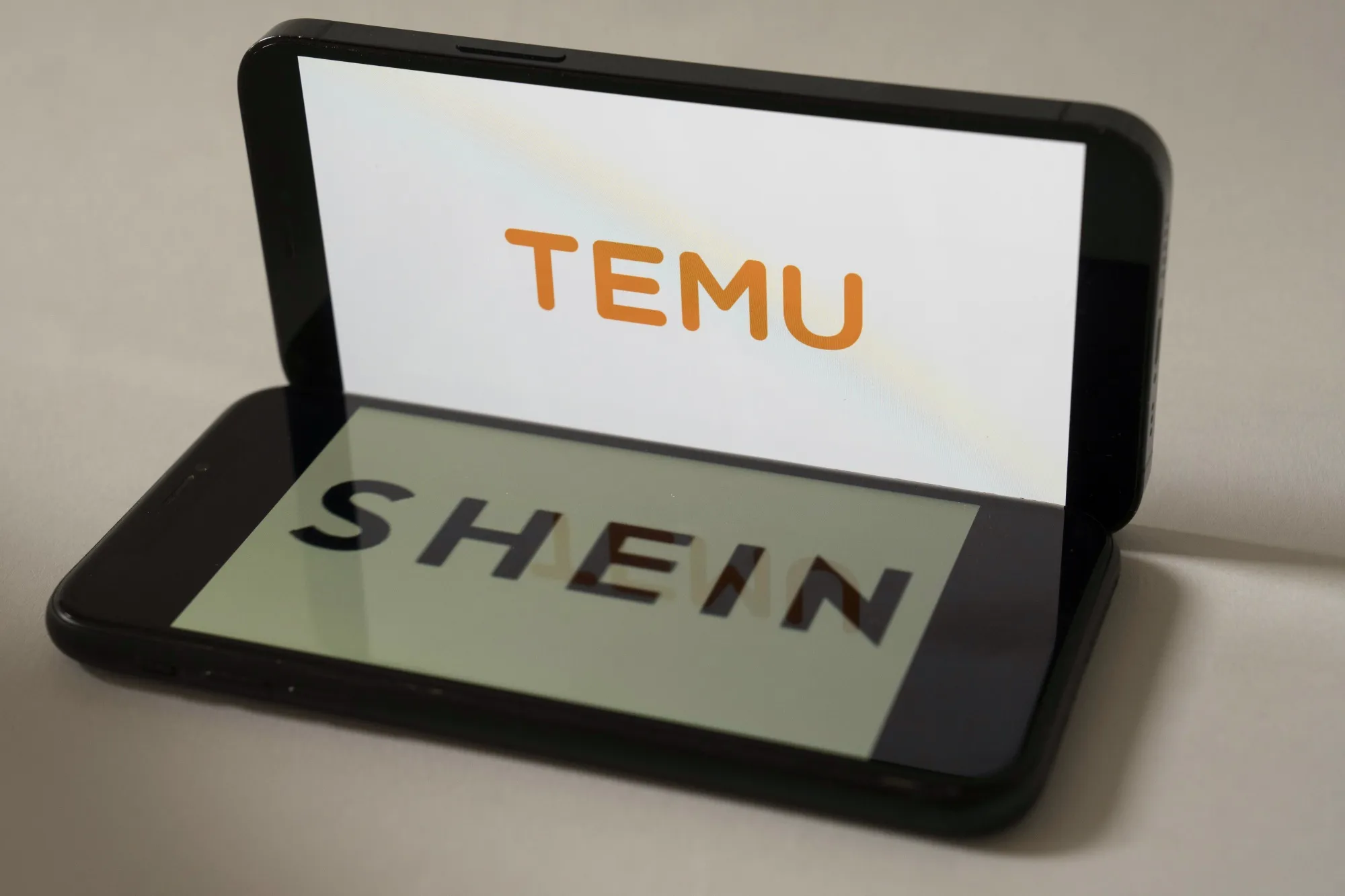 Logos for PDD Holdings Inc.’s Temu and Shein.