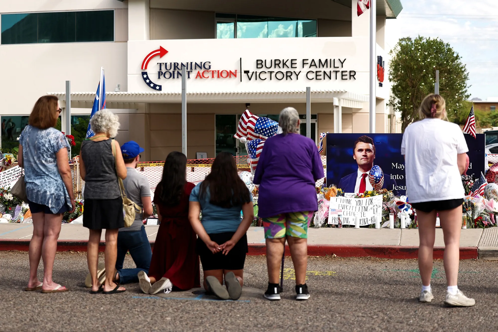 People mourn Charlie Kirk outside of the Turning Point USA headquarters&nbsp;in Phoenix, Arizona, on Sept. 12