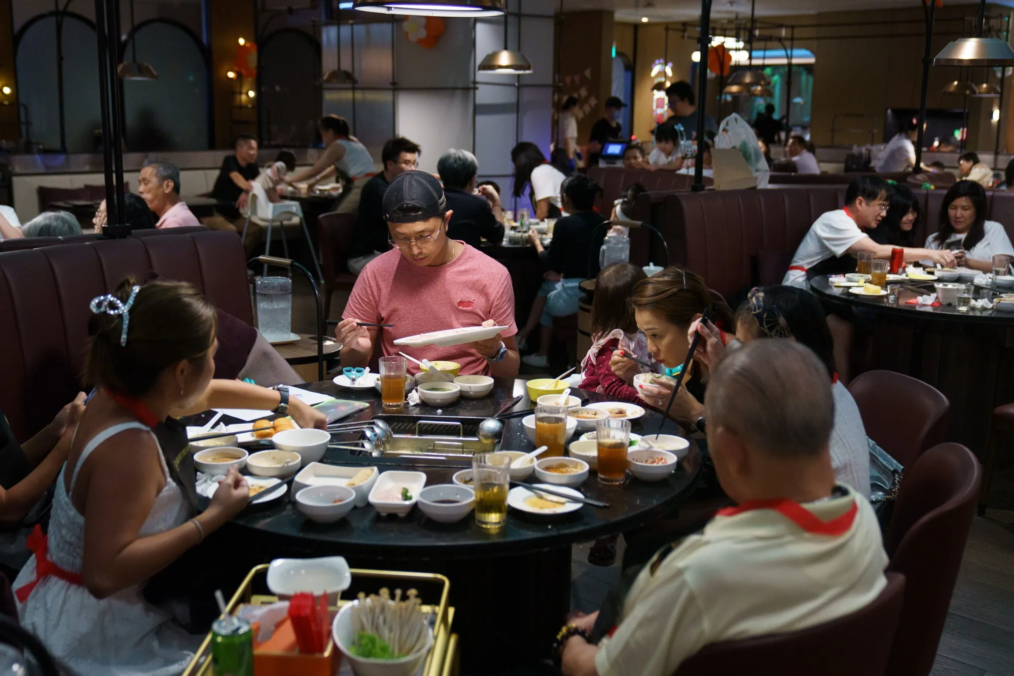 Customers at a Haidilao International Holding Ltd. hotpot restaurant in Singapore.