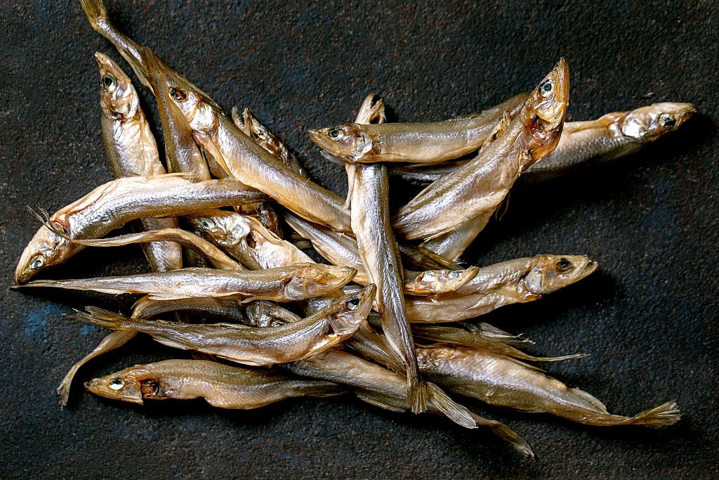 Heap Dried Sun-dried Sea Fish Smelt Hamsa Anchovy on Dark Textured Background. Salty Traditional Appetizer. Sea Food Background. (Photo by: Natasha Breen/REDA/Universal Images Group via Getty Images)