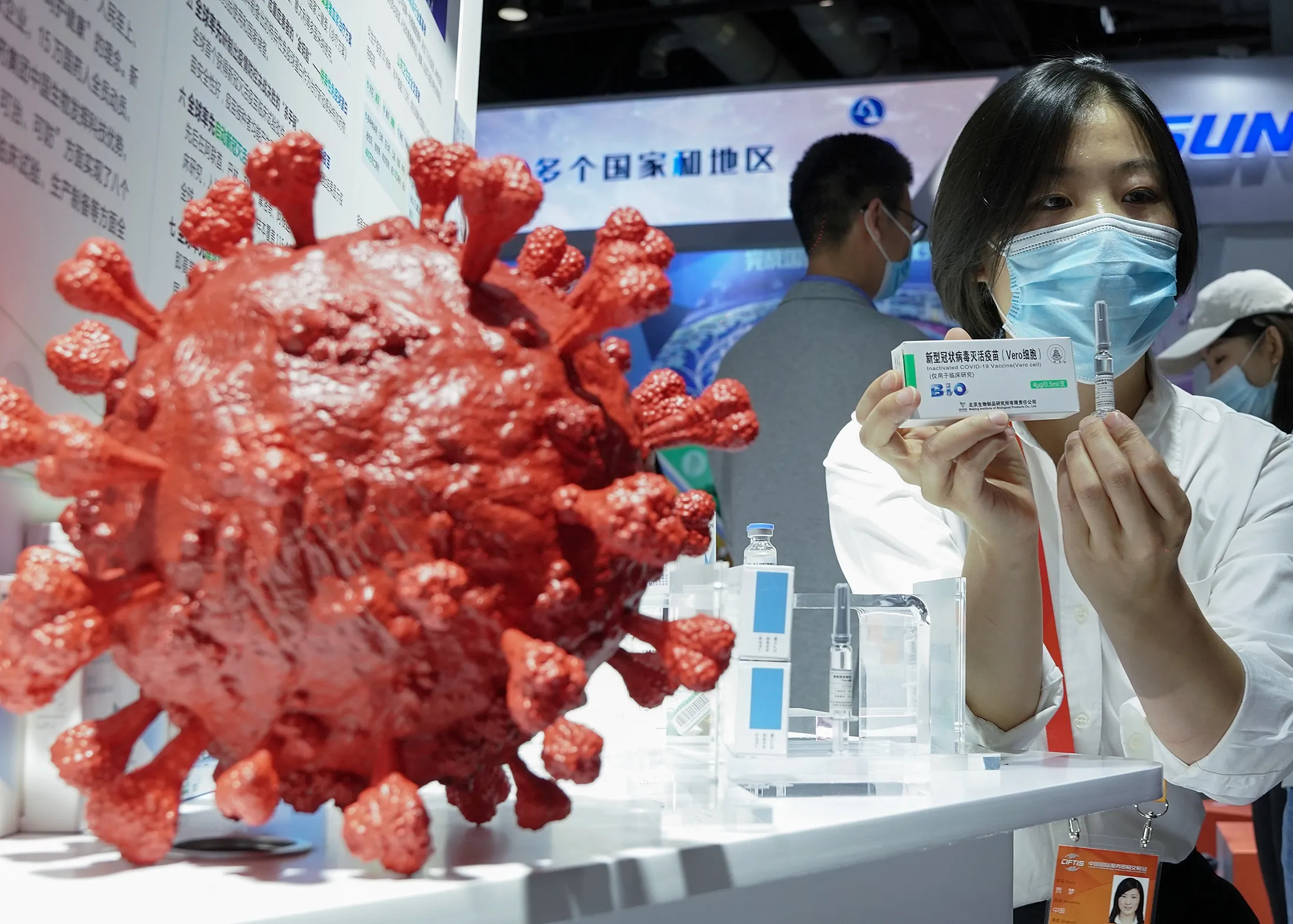 An employee displays a coronavirus vaccine candidate from China National Biotec Group (CNBG)&nbsp;during the 2020 China International Fair for Trade in Services (CIFTIS) in Beijing, China, on Sept. 5