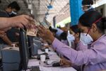 People register and pay before receiving a dose of Covishield, the local name for the Covid-19 vaccine, at a Covid-19 vaccination center set up at the BLK Super Speciality Hospital in New Delhi on May 21.