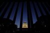 The National Diet building is seen through the main gate as it stands illuminated at dusk in Tokyo, Japan, on Monday, Jan. 20, 2020. Prime Minister Shinzo Abe opened a new session of parliament on Monday with a fresh call to revise the country's U.S.-imposed postwar constitution.
