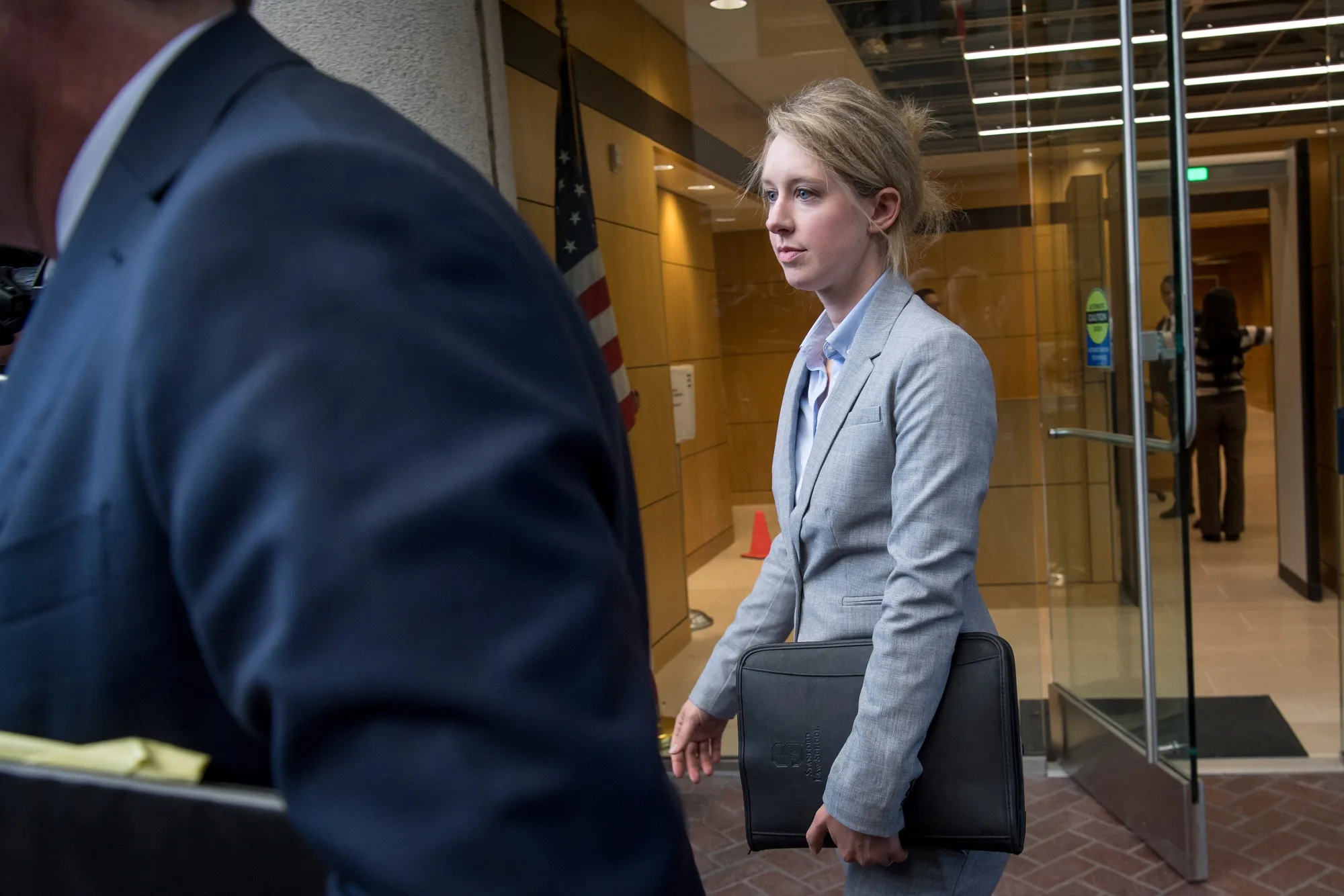 Elizabeth Holmes exits federal court on April 22.
