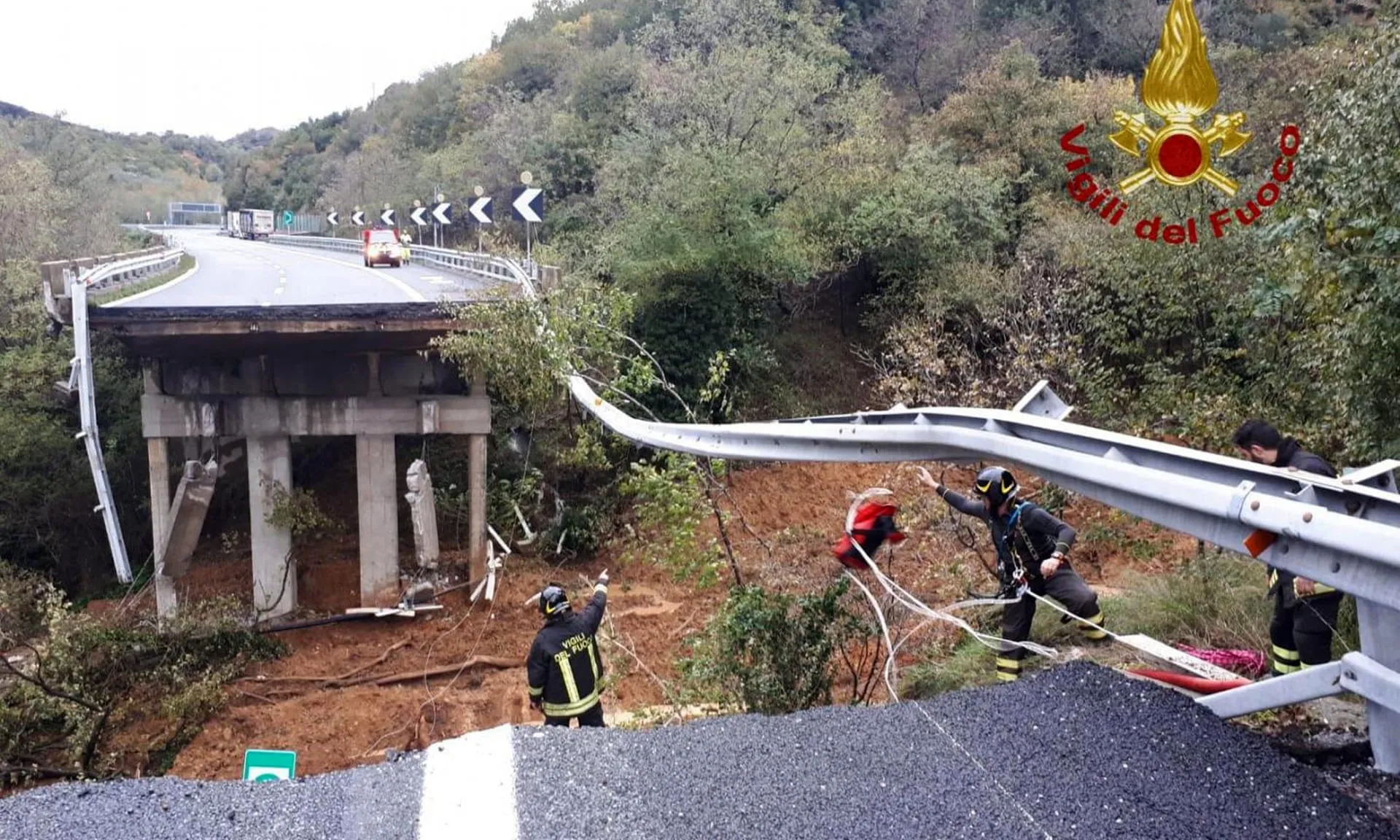 Firefighters work at the site of a bridge collapse in Savona, Italy, on Nov. 24.