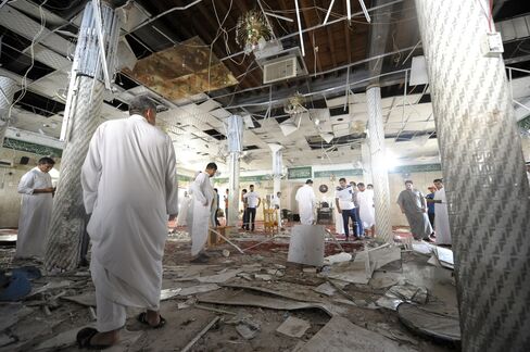 Men gather inside a mosque following an attack that left 21 people dead in Qatif on May 22, 2015. Photographer: Hussein Radwan/AFP via Getty Images