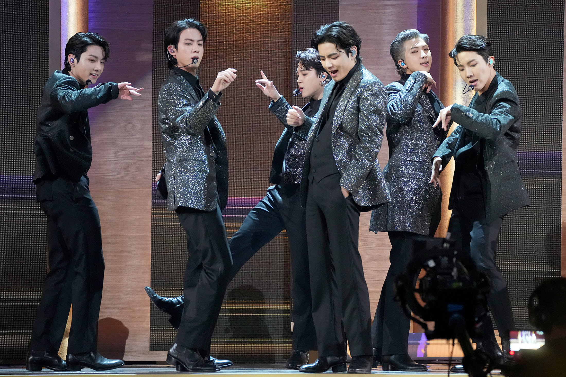 Jungkook, from left, Jin, Jimin, V, RM, and J-Hope of BTS perform onstage at MGM Grand Garden Arena on in Las Vegas, Nevada, in 2022.