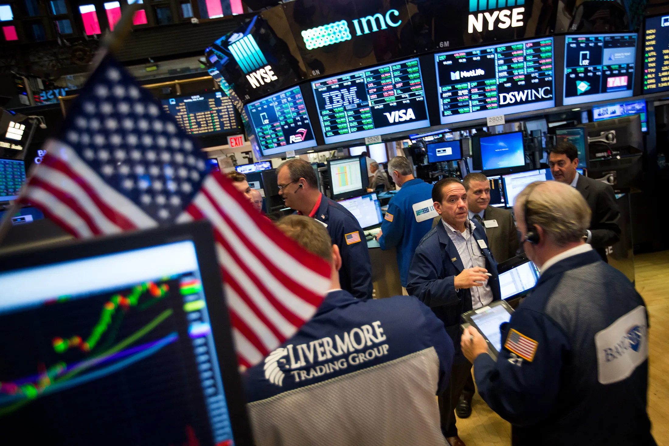Traders work on the floor of the New York Stock Exchange (NYSE) in New York on July 3, 2017.
