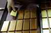 An employee arranges one kilogram gold bars at the Perth Mint Refinery, operated by Gold Corp., in Perth, Australia, on Thursday, Aug. 9, 2018. Demand for coins and minted bars was a little sluggish over the past year as Donald Trump's earlier win in the presidential poll prompted investors to divert funds into stocks, bonds and property, said Perth Mint's Chief Executive Officer Richard Hayes on Aug. 8.