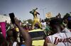 A man painted in the colours of Malian flag gestures at Independance square as protesters gather to demand the resignation of Ibrahim Boubacar Keita, in Bamako on June 19.