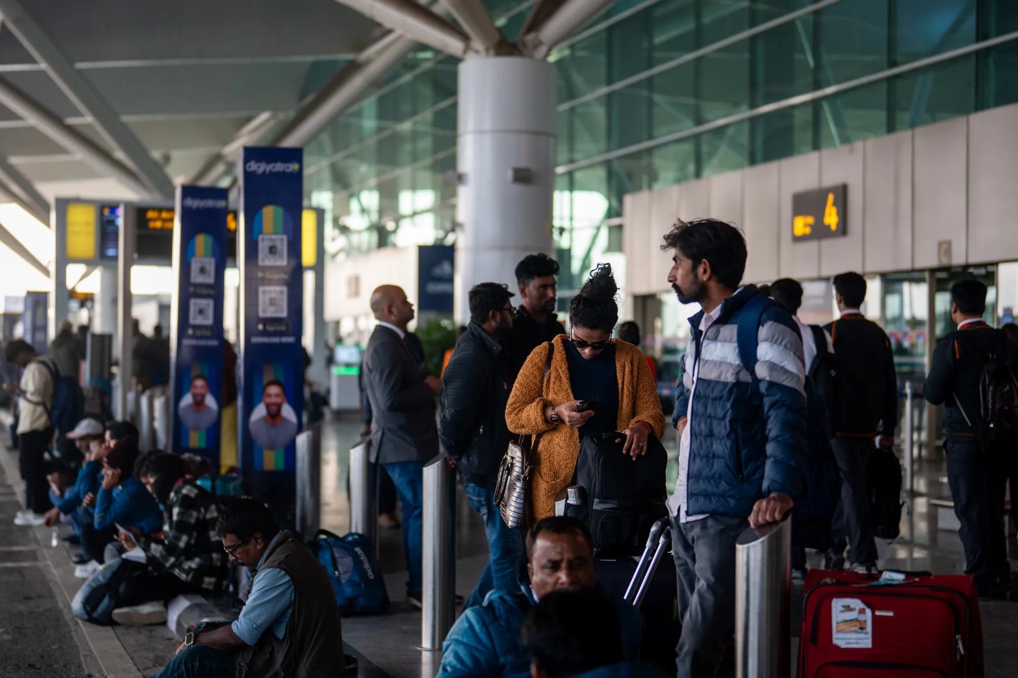 Travelers at Indira Gandhi International Airport in New Delhi, on Dec. 5.
