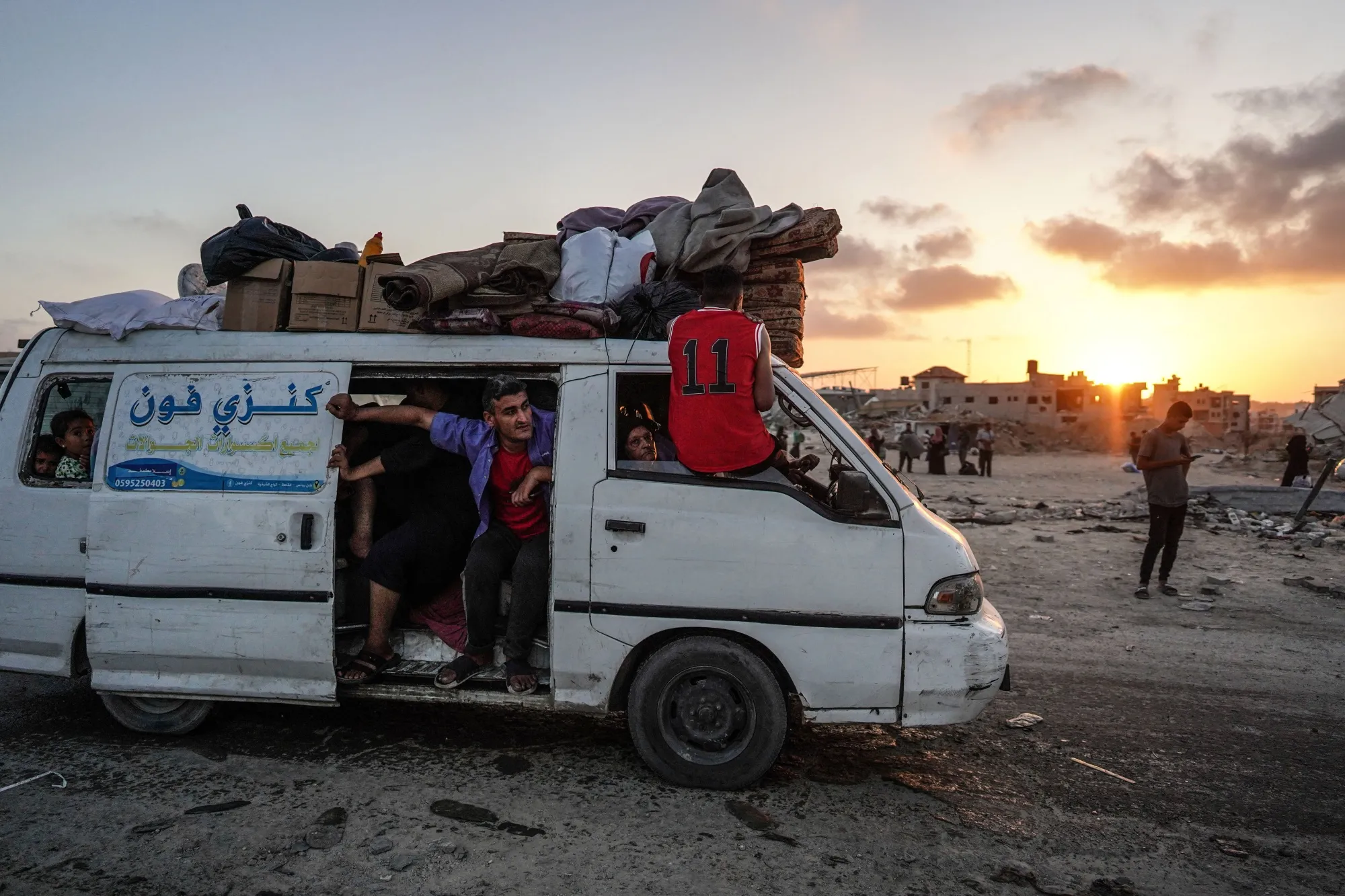 Displaced Palestinians leave an area in east Khan Younis&nbsp;on July 1.
