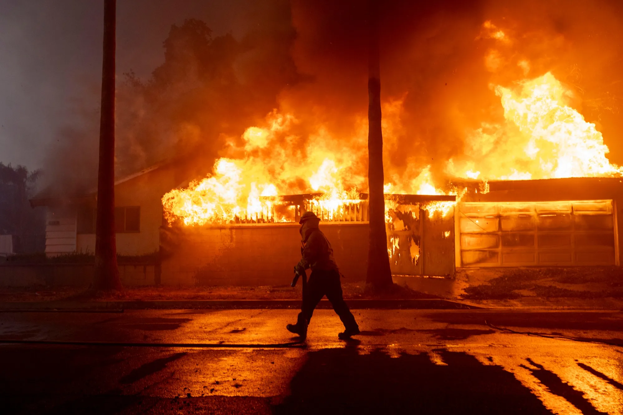 A firefighter battles the Eaton Fire in Altadena, California, on Jan. 8.