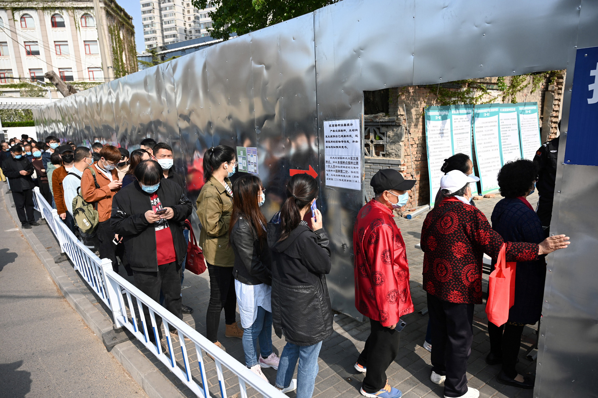 People line up for Covid-19 vaccines in Beijing on April 8.
