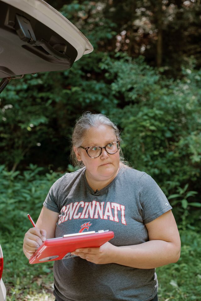 Amy Townsend-Small (right), an associate professor of environmental science at the University of Cincinnati, is one of a growing tribe of methane hunters. She uses an Indaco Hi-Flow Sampler (left) to measure methane escaping from a leaking natural gas well in West Virginia.