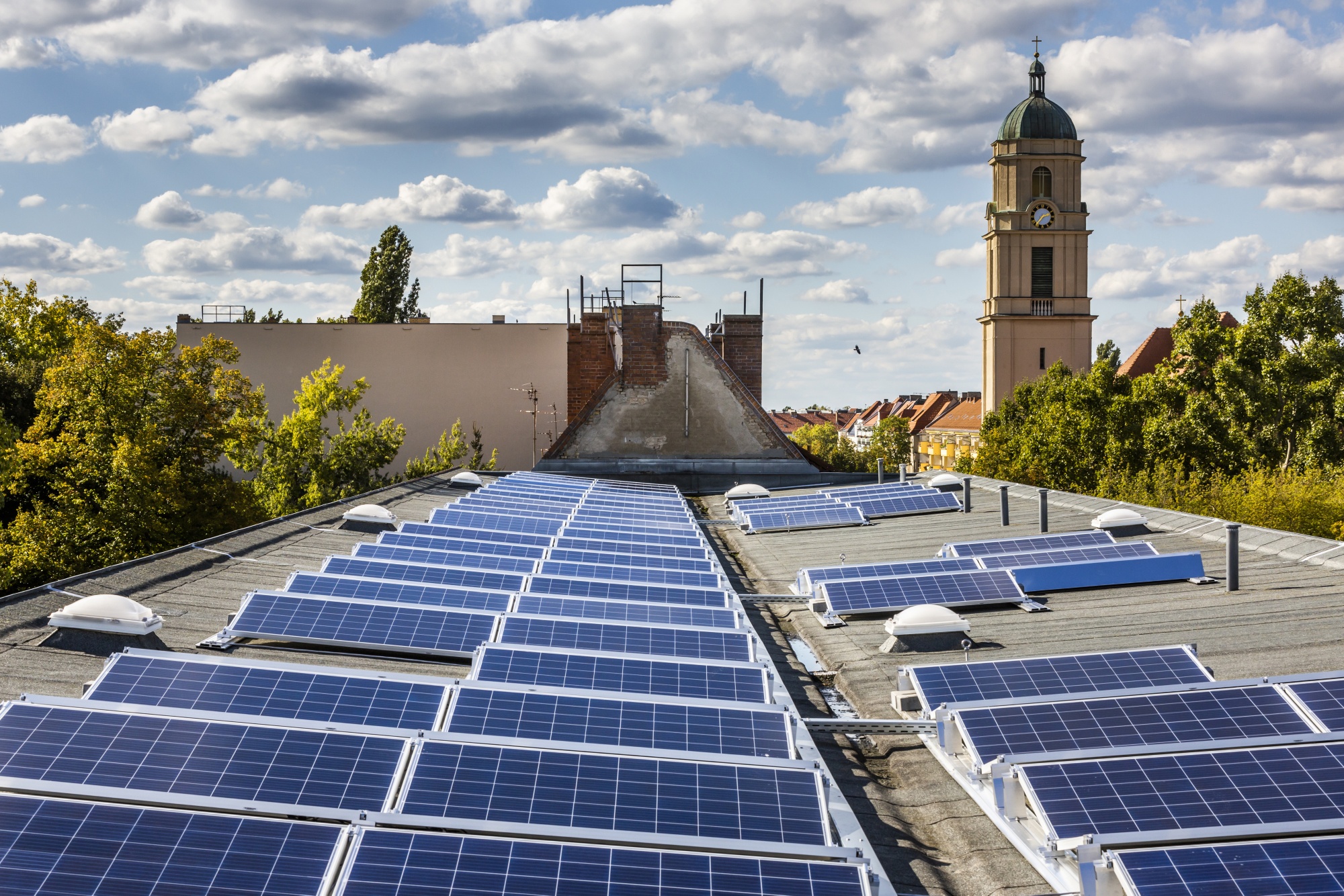 Newly installed solar panels sit on the roof of an apartment block in the Pankow district of Berlin, Germany.