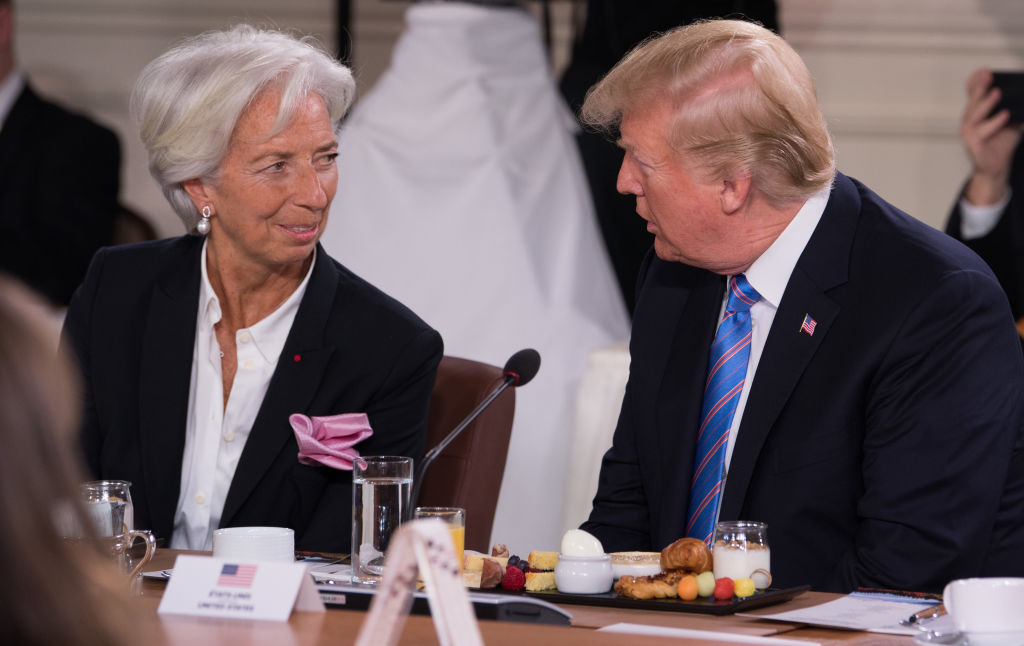 US President Donald Trump speaks with International Monetary Fund Managing Director Christine Lagarde as they attend the Gender Equality Advisory Council Breakfast during the G7 Summit in La Malbaie, Quebec, Canada, June 9, 2018. (Photo by SAUL LOEB / AFP) (Photo credit should read SAUL LOEB/AFP via Getty Images)