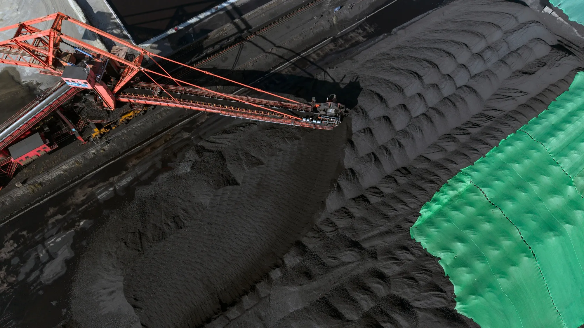 Stockpiles of coal at a sorting and storage facility near the Beilun Port in Ningbo, China.