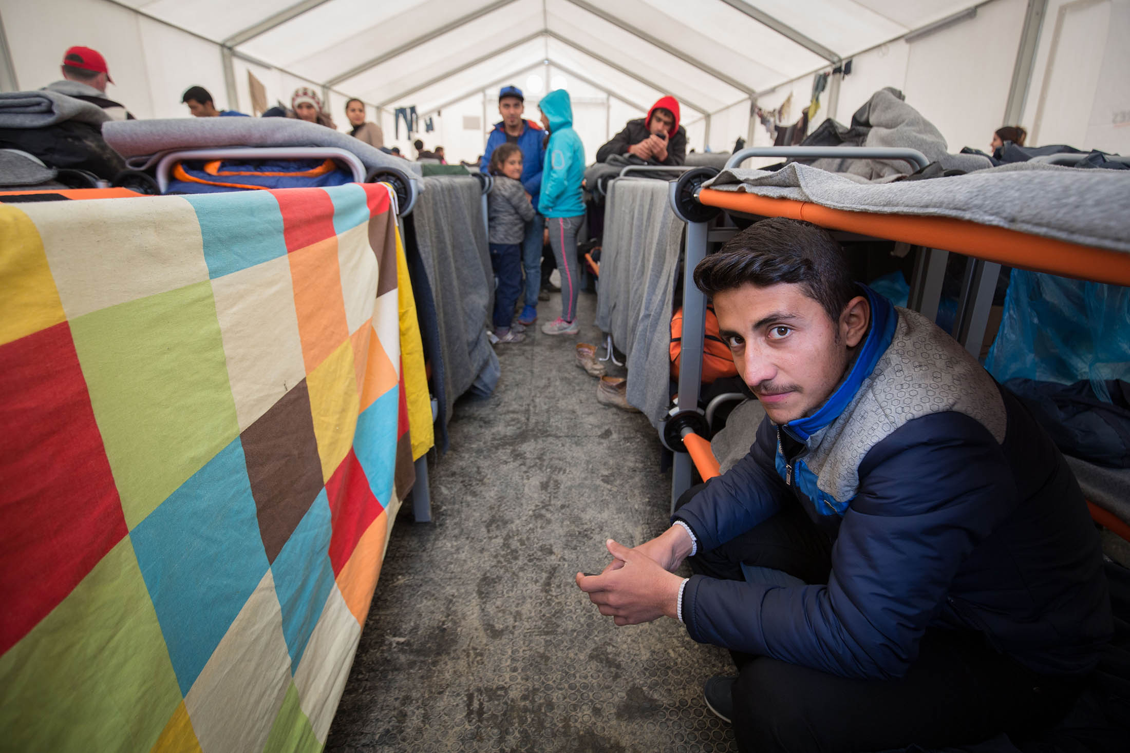 A man sits on his bunk bed inside a accommodation tent at the Idomeni refugee camp on the Greek Macedonia border on March 16.
