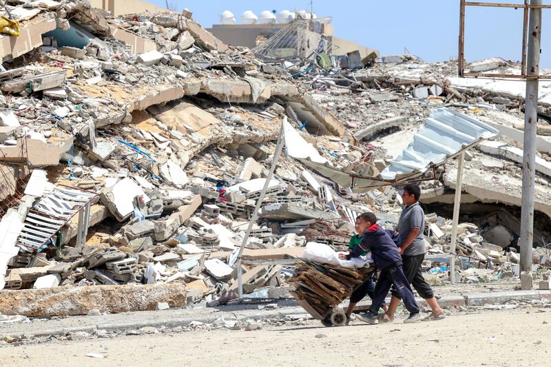 Residents collect cardboard and wooden pallets in Beit Lahya, Gaza on May 4.