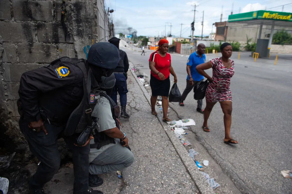 Haitian police officers deploy in Port-au-Prince as they exchange gunfire with alleged gang members last month.