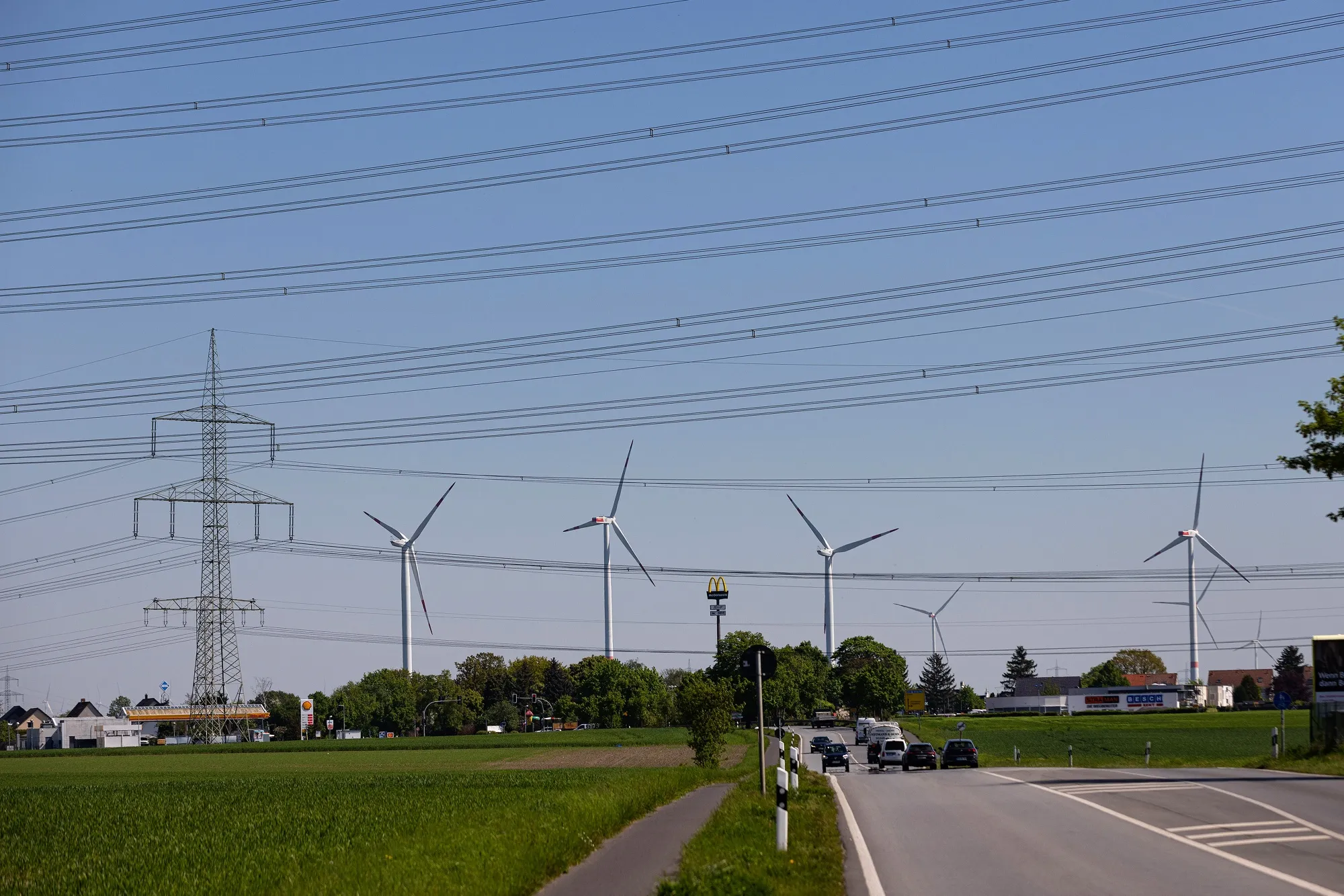 Wind turbines and electricity transmission pylons in Lindenberg, Germany.