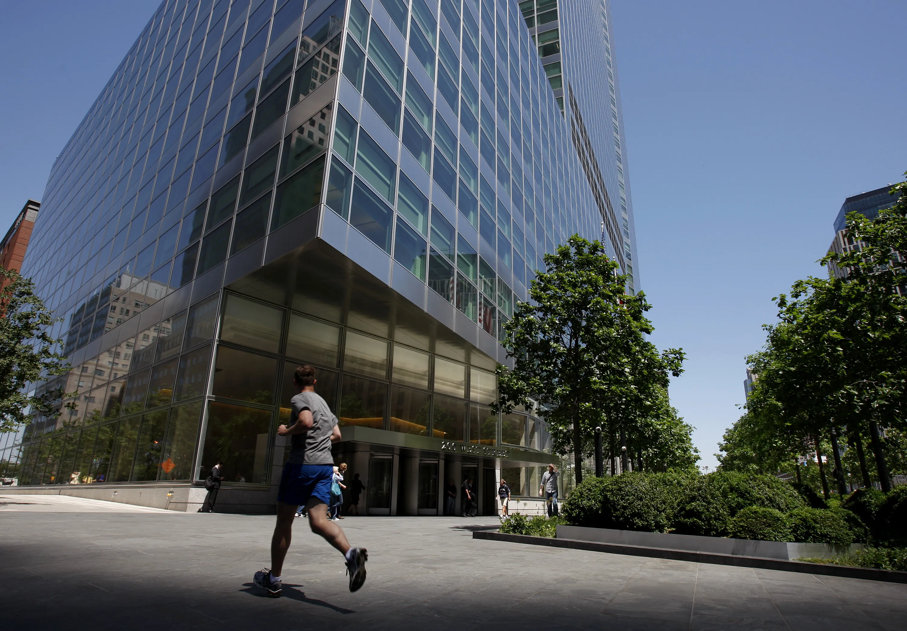 A pedestrian passes in front of the headquarters of Goldman Sachs Group Inc., in New York.