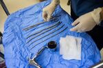 A medical assistant arranges tools for a procedure at the Whole Woman's Health abortion clinic in San Antonio, Texas, on Tuesday, Feb. 16, 2016.