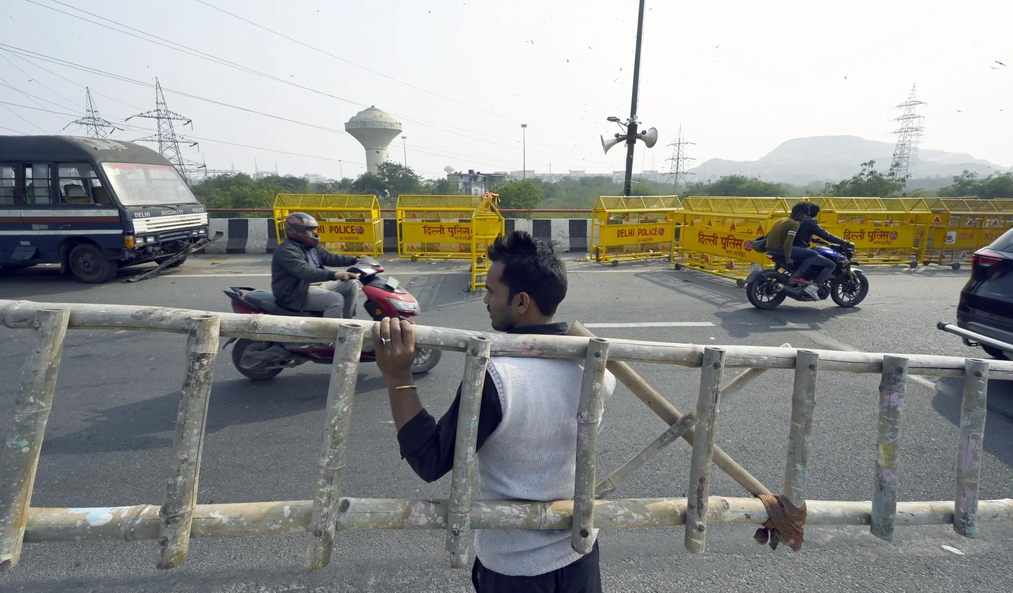 Delhi police set up security measures at the Ghazipur border, ahead of a farmers march to Delhi, on Feb. 11.
