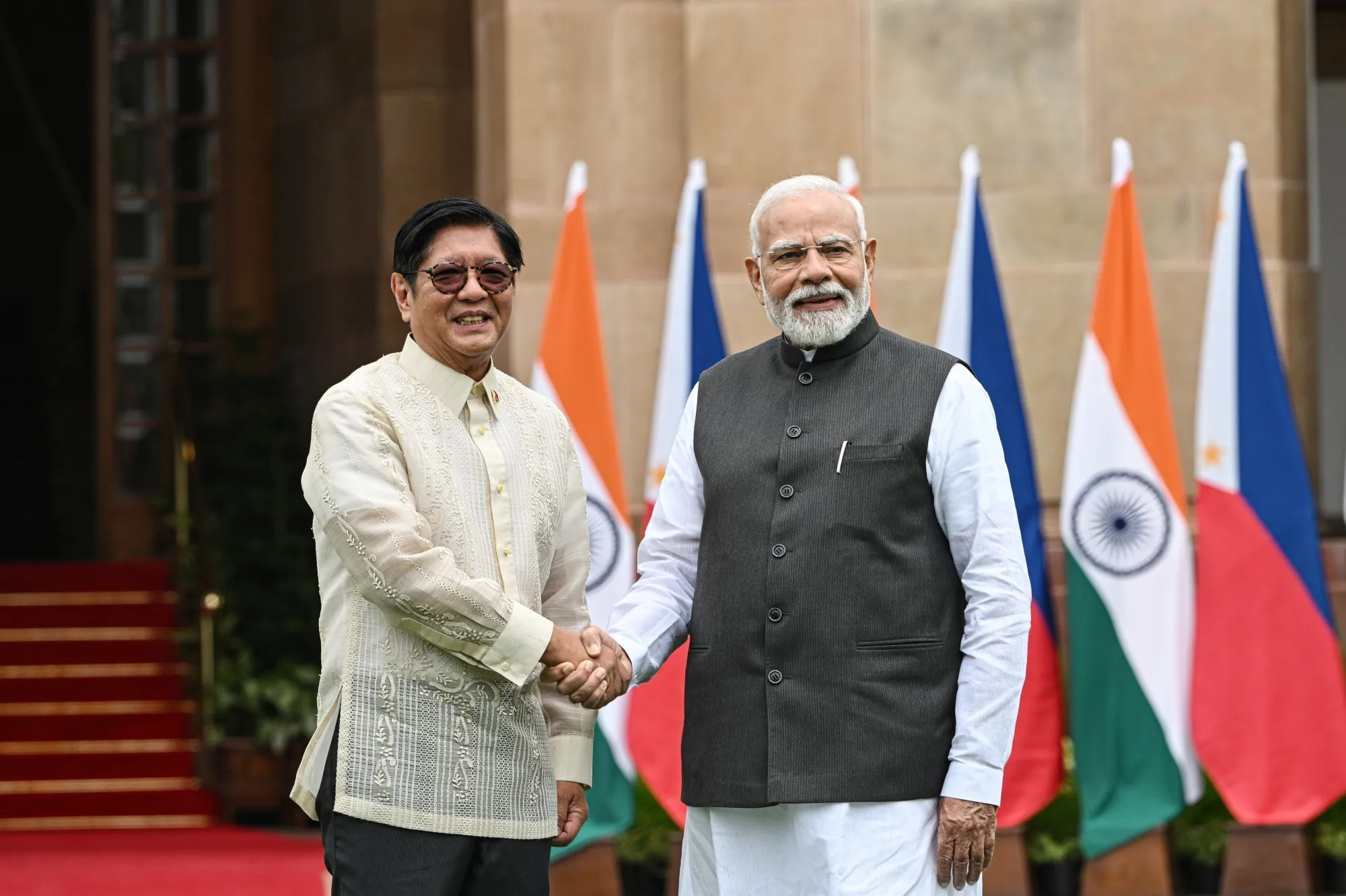 Narendra Modi, right, shakes hands with Ferdinand Marcos Jr., at the presidential palace in New Delhi, on Aug. 5.