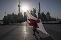 Office Workers in Shanghai as Premier Says Most of China Is Returning to Normal