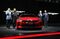 Park Han-woo, president and co-chief executive officer of Kia Motors Corp., left, Peter Schreyer, co-chief executive officer, second left, and Lee Hyoung-keun, vice chairman, second right, stand for a photograph next to company's Stinger vehicle during the press day of the Seoul Motor Show in Goyang, South Korea, on Thursday, March 30, 2017. Hyundai Motor Co. and Kia plan to have 28 eco-friendly models by 2020, including a Kiafuel-cell car and a luxury Genesis electric vehicle. Photographer: SeongJoon Cho/Bloomberg