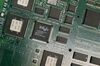 An Intel chip is seen in a circuit board on Jan. 15, 2003.