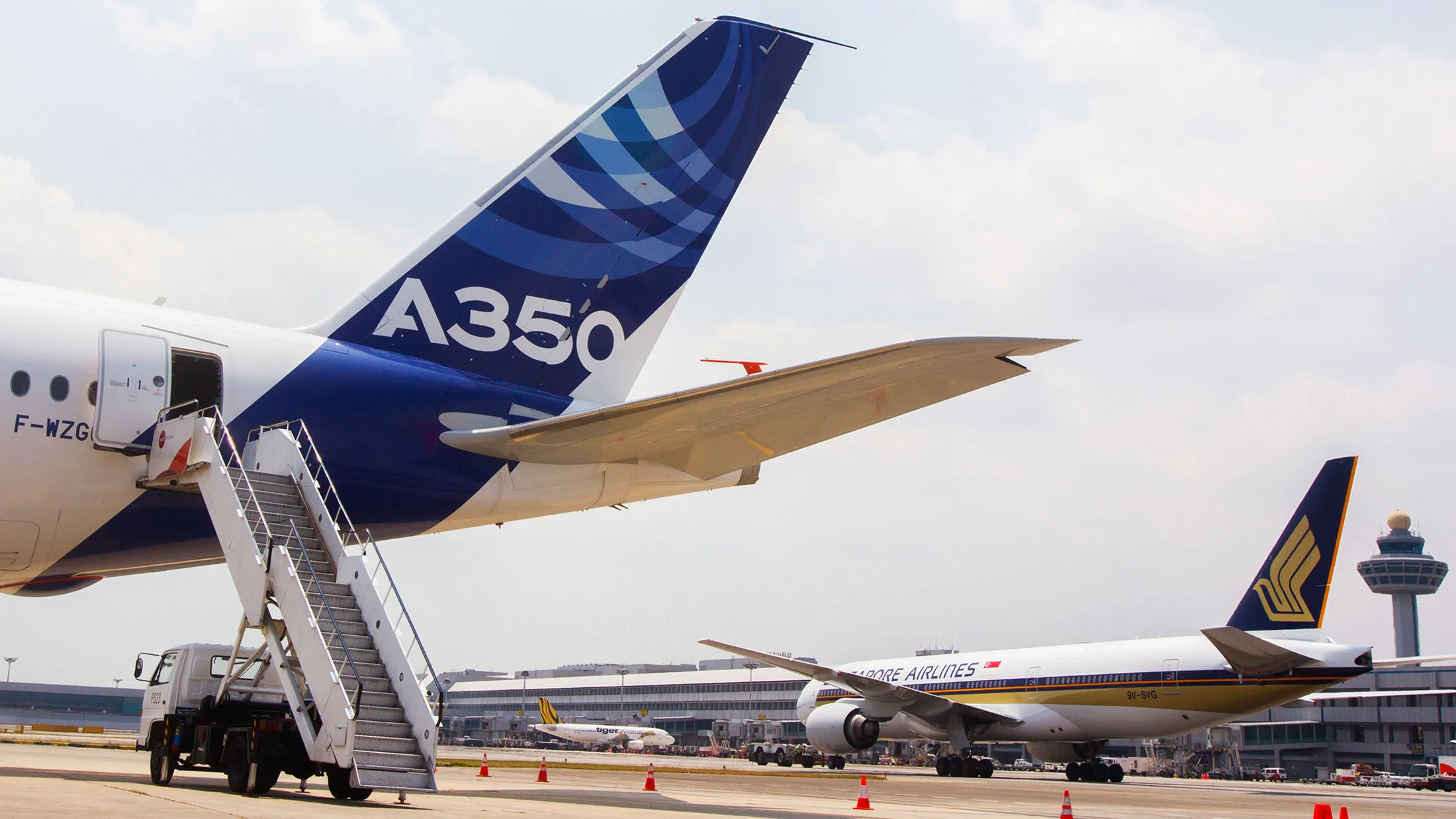 The Airbus A350 next to a Singapore Airlines plane in Singapore.
