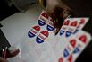 A poll worker organizes stickers in Philadelphia on April 26, 2016.
