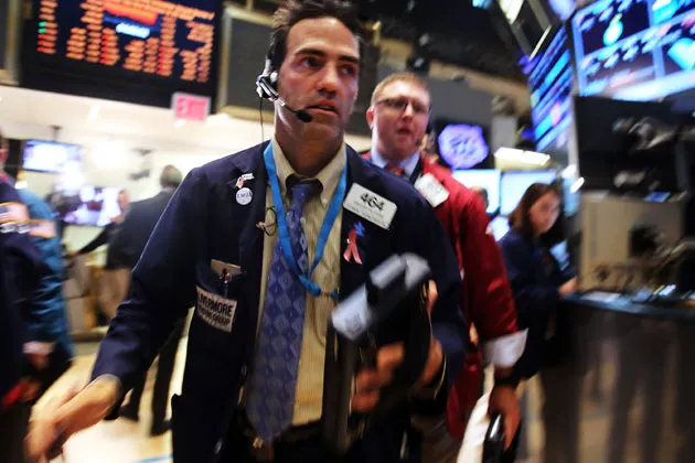 Traders on the floor of the New York Stock Exchange on June 20