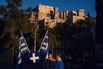 Tourists near the Acropolis in Athens.