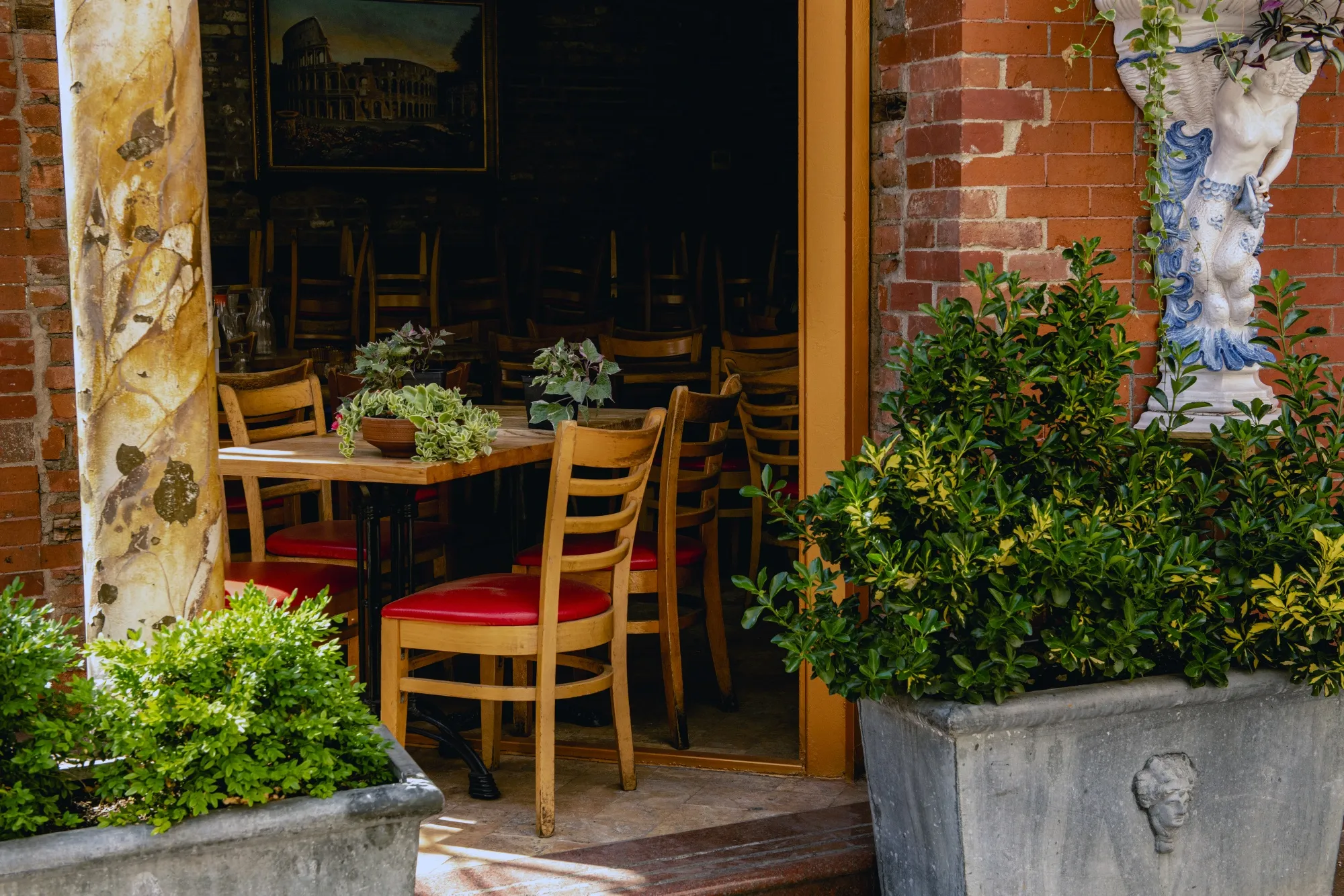An inside dining area of a restaurants stands empty in the Little Italy neighborhood of New York.