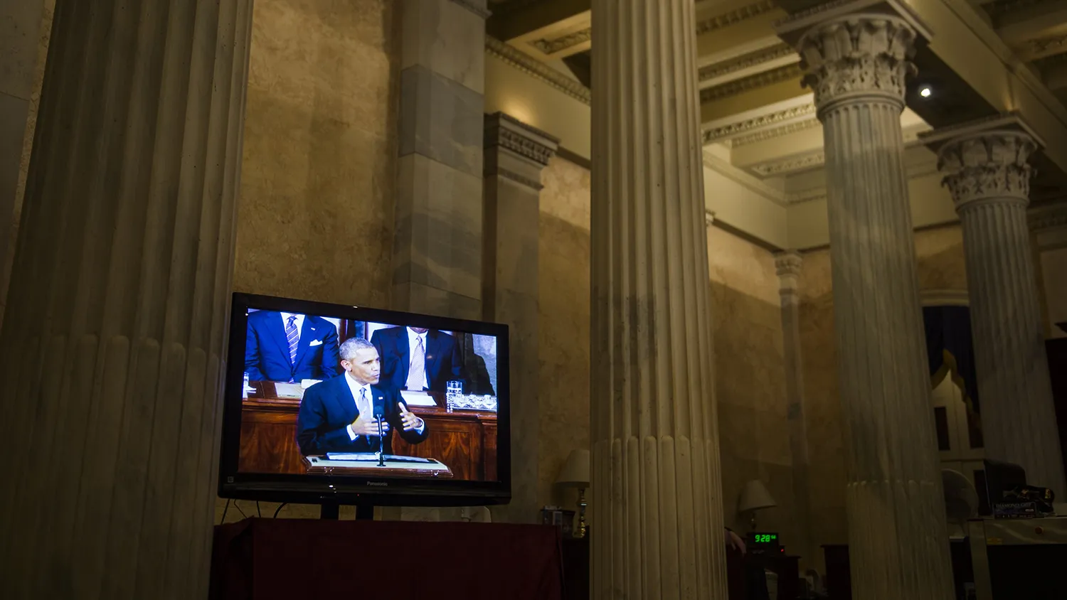 US President Barack Obama appears on a television monitor at the US Capitol as he delivers the State of the Union address in Washington, DC, January 20, 2015.
