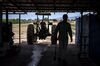 The silhouette of a worker sweeping the floor is seen at Diaz Farms in Deming, New Mexico, U.S., on Friday, Aug. 5, 2016. According to the United States Department of Agriculture, sales of farm and ranch products contributed nearly $3.7 billion to New Mexicos economy in 2014.