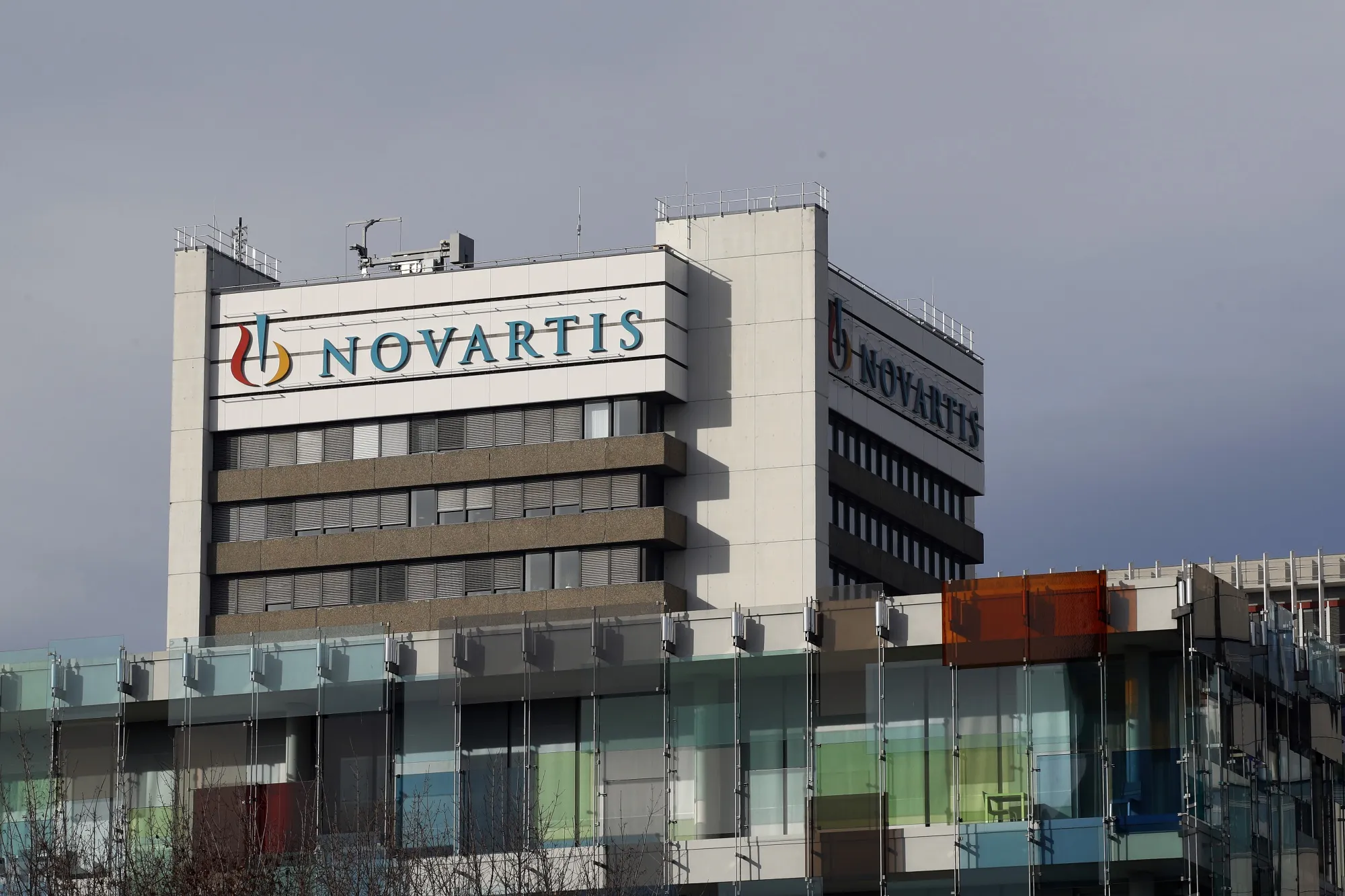 A logo sits on display on a building at the Novartis AG campus in Basel, Switzerland, on Wednesday, Jan. 16, 2019.&nbsp;