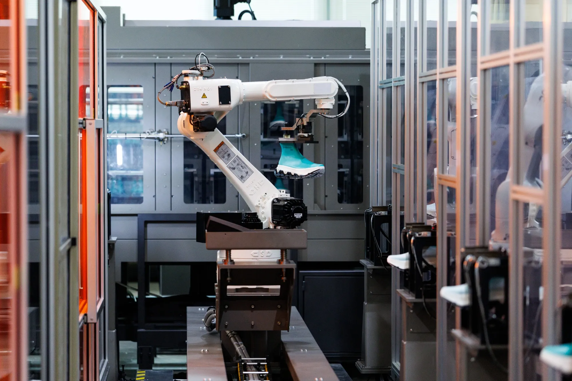 An automated robot operates at the newly opened factory for On Holding AG near Busan, on Feb. 25.