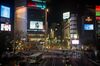 Pedestrians cross an intersection in the Shibuya district of Tokyo, Japan, on Friday, Jan. 8, 2021. The state of emergency over the coronavirus that went into effect Friday for Tokyo and its surrounding area will weigh on Japan's economy this quarter, said Japan's Finance Minister Taro Aso.